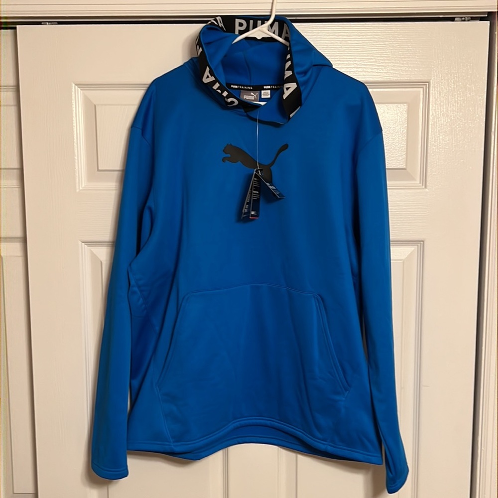 Puma hoodie with logo on front and puma wording around hood.
